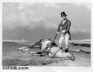 A Man In A Top Hat Is Standing Next To A Dead Horse On Top Of A Hill . GIF