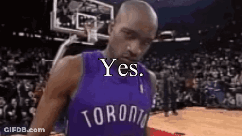 A Man In A Toronto Raptors Jersey Is Standing On A Basketball Court With A Basketball Hoop In The Background . GIF