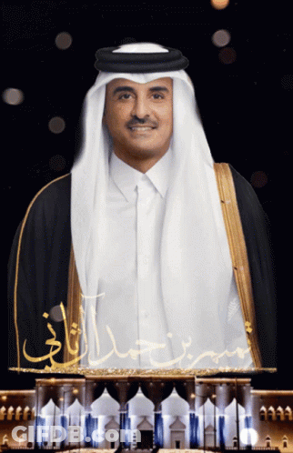 A Man In A Traditional Costume With Arabic Writing Behind Him GIF