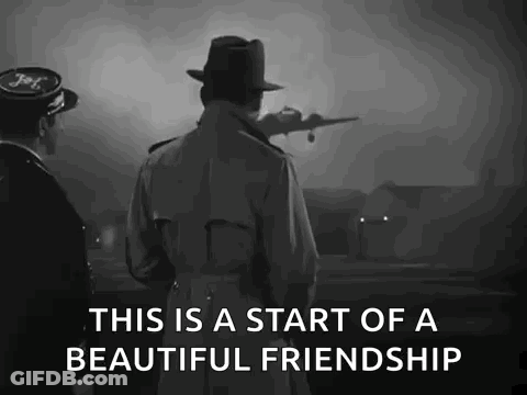 A Man In A Trench Coat And Hat Is Standing Next To A Man In A Hat Looking At A Plane Taking Off . GIF