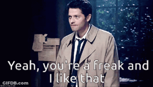 A Man In A Trench Coat And Tie Is Saying " Yeah You 'Re A Freak And I Like That " GIF
