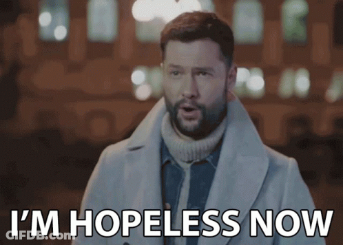 A Man In A Trench Coat Is Saying I 'M Hopeless Now GIF