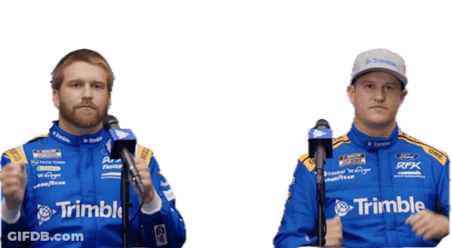 A Man In A Trimble Racing Suit Stands Next To Another Man In A Trimble Racing Suit GIF