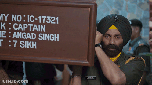 A Man In A Turban Holds Up A Sign That Says My No Ic-17321 GIF