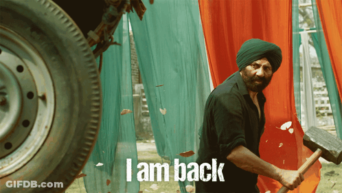 A Man In A Turban Is Holding A Hammer And The Words I Am Back Are On The Bottom GIF