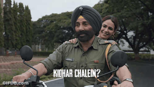 A Man In A Turban Is Riding A Motorcycle Next To A Woman With The Words Kidhar Chalein Written Below Him GIF