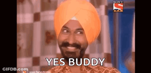 A Man In A Turban Is Smiling And Says Yes Buddy . GIF