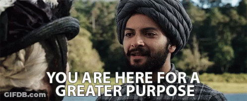 A Man In A Turban Is Talking To A Woman With The Words You Are Here For A Greater Purpose . GIF