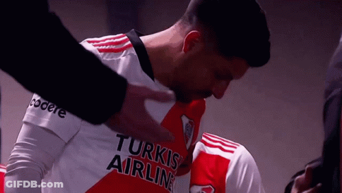 A Man In A Turkish Airlines Jersey Is Being Comforted GIF