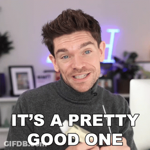 A Man In A Turtleneck Sweater Is Smiling With The Words It 'S A Pretty Good One Above Him GIF