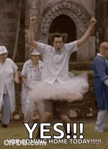 Man In Tutu Jumping In Air With Group Behind GIF
