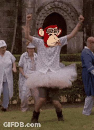 A Man In A Tutu With A Monkey Face On His Face GIF