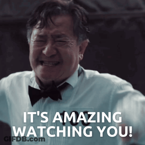 A Man In A Tuxedo And Bow Tie Crying With The Words It 'S Amazing Watching You Behind Him GIF