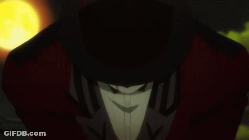 A Man In A Tuxedo And Bow Tie Holds A Yellow Object In His Hand GIF