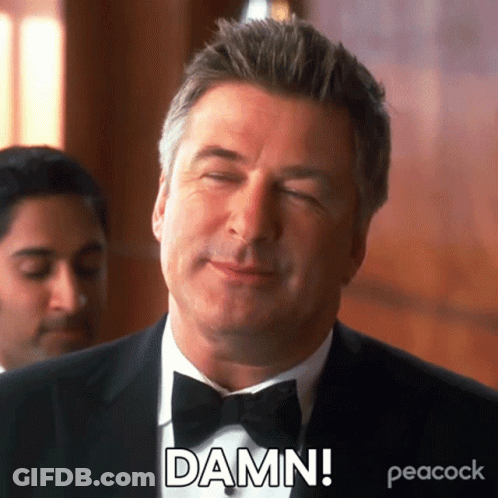 A Man In A Tuxedo And Bow Tie Is Making A Funny Face And Saying Damn . GIF