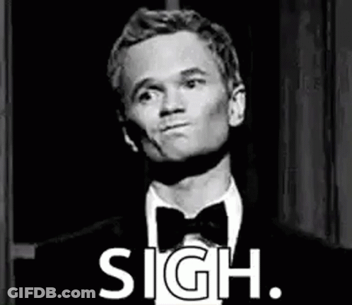 A Man In A Tuxedo And Bow Tie Is Making A Funny Face And Says Sigh . GIF