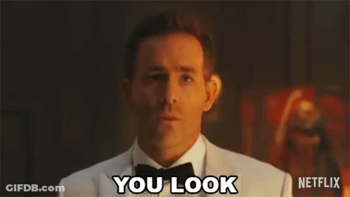 A Man In A Tuxedo And Bow Tie Is Making A Surprised Face And Says `` You Look '' . GIF