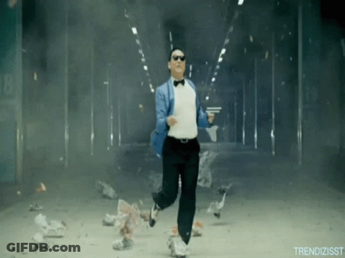 A Man In A Tuxedo And Bow Tie Is Running Through A Smokey Tunnel GIF