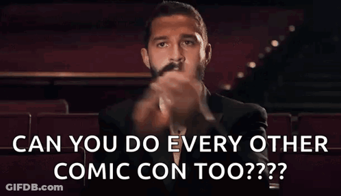 A Man In A Tuxedo And Bow Tie Is Sitting In A Theater And Asking Can You Do Every Other Comic Con Too . GIF
