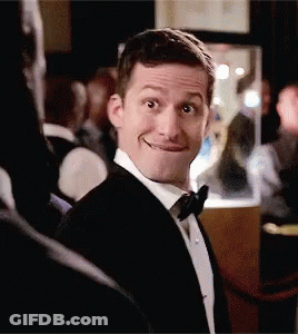 Man In Tuxedo Making A Face Smiling GIF