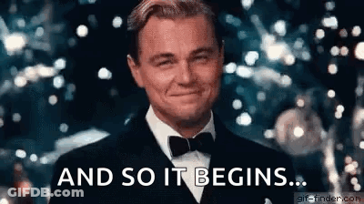 A Man In A Tuxedo And Bow Tie Is Smiling And Saying `` And So It Begins '' . GIF