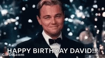 A Man In A Tuxedo And Bow Tie Is Smiling And Saying `` Happy Birthday David ! '' GIF