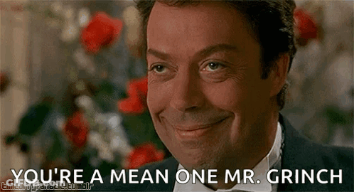 A Man In A Tuxedo And Bow Tie Is Smiling And Saying You 'Re A Mean One Mr. Grinch . GIF