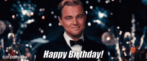 A Man In A Tuxedo And Bow Tie Is Smiling And Says Happy Birthday GIF