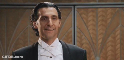 A Man In A Tuxedo And Bow Tie Says " I Am ... " GIF