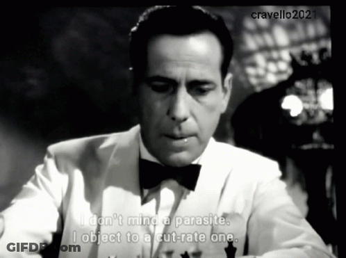 A Man In A Tuxedo And Bow Tie Says " I Do N't Mind A Parasite " GIF