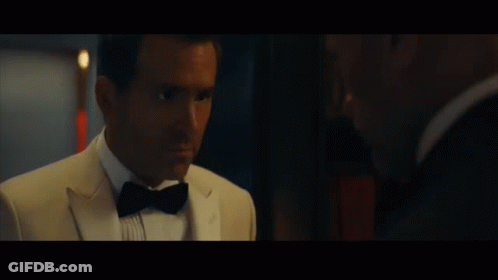 A Man In A Tuxedo And Bow Tie Says " You Love Me " GIF