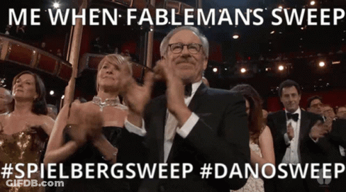 A Man In A Tuxedo Applauds At An Awards Show GIF