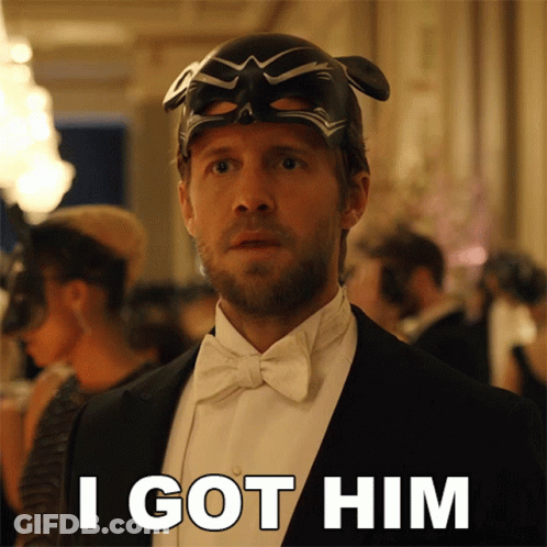 A Man In A Tuxedo Has A Mask On His Head And Says I Got Him GIF