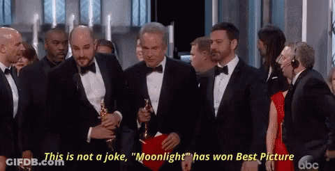 A Man In A Tuxedo Holding An Oscar Says " This Is Not A Joke Moonlight Has Won Best Picture " GIF