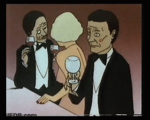 A Man In A Tuxedo Holds A Glass Of Wine While A Woman Holds A Glass Of Wine GIF