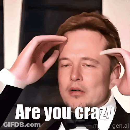 A Man In A Tuxedo Holds His Hands To His Forehead With The Words Are You Crazy Written Below Him GIF