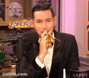 A Man In A Tuxedo Is Eating Noodles In Front Of A Lakers Candy Bar GIF