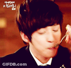 A Man In A Tuxedo Is Eating Something With A Fork And Spoon GIF