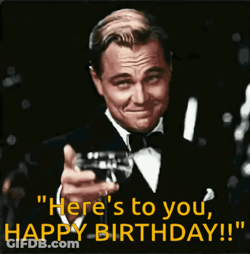 A Man In A Tuxedo Is Holding A Glass Of Wine And Says " Here 'S To You Happy Birthday !! " GIF