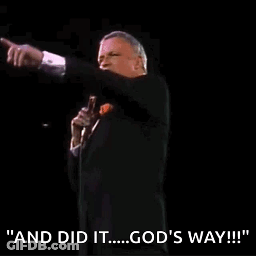 A Man In A Tuxedo Is Holding A Microphone And Saying " And Did It ... God 'S Way " GIF