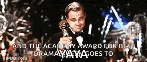 A Man In A Tuxedo Is Holding An Oscar Trophy With The Words " And The Academy Award For Best Drama " Written Below Him GIF