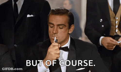 A Man In A Tuxedo Is Lighting A Cigarette With The Words But Of Course Behind Him GIF