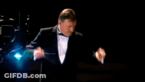 A Man In A Tuxedo Is Pointing At The Word Banned In Red GIF