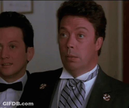 A Man In A Tuxedo Is Smiling And Says I Love You GIF
