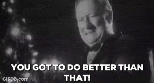 A Man In A Tuxedo Is Smiling In Front Of A Christmas Tree And The Words `` You Got To Do Better Than That '' . GIF