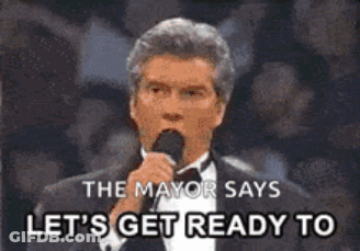 A Man In A Tuxedo Is Speaking Into A Microphone And Says Let 'S Get Ready To GIF