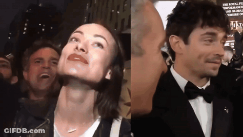 A Man In A Tuxedo Kisses A Woman 'S Forehead GIF