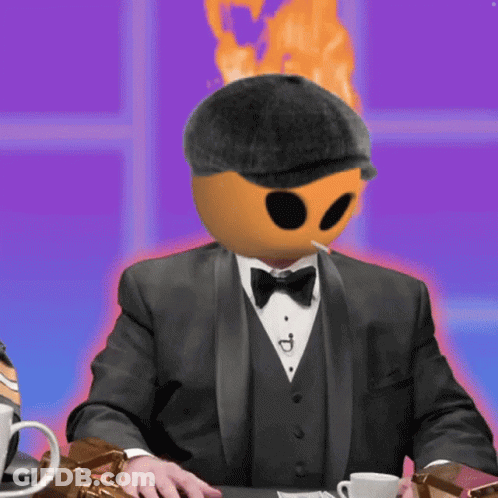 A Man In A Tuxedo Smoking A Cigarette With A Fireball On His Head GIF