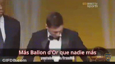 A Man In A Tuxedo Stands In Front Of A Microphone With The Words Mas Ballon D' Or Que Nadie Mas On The Bottom GIF