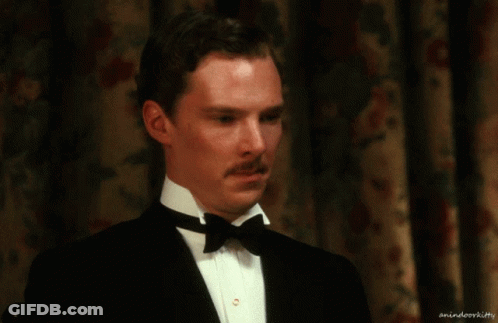 A Man In A Tuxedo With A Bow Tie Has A Watermark That Says Animateorkitty GIF